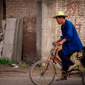 Journey Through Poverty: Solitary Cyclist in a Chinese Neighborhood Giclee / Colored / 5 x 7 Tracy McCrackin Photography - Tracy McCrackin Photography