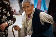 Load image into Gallery viewer, white-haired-tibetan-with-cane Tracy McCrackin Photography GiclŽe - Tracy McCrackin Photography